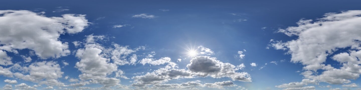 360 hdri blue sky with beautiful clouds with halo like a seamless panorama view with zenith for use in 3d graphics or game development as sky dome or edit drone shot