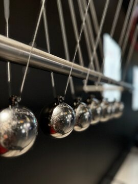 Newtons cradle metal pendulum balls close up