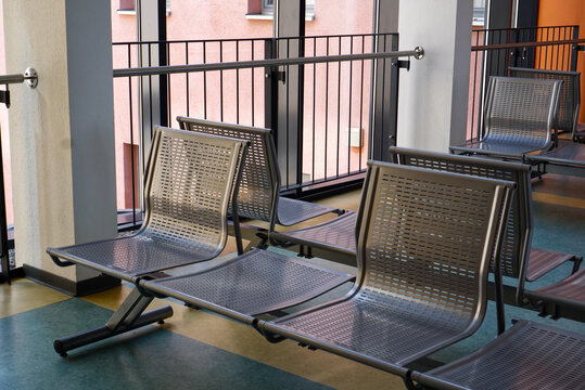 Metal seats in an empty waiting area of a public building