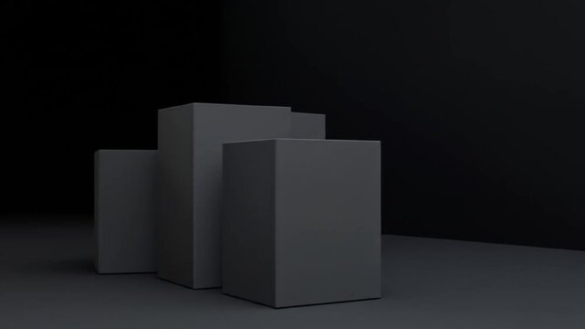 Three dark grey rectangular prisms arranged on a dark surface against a black background
