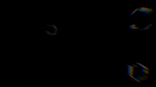 Floating iridescent soap bubbles against a dark black background.