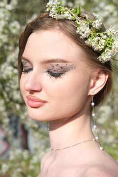 young woman in a black dress. summer nature. portrait in sunny spring day