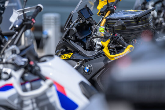 Varberg, Sweden - May 14 2026: BMW adventure motorcycle cockpit with yellow protective hand guards.