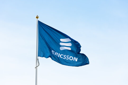 Gothenburg, Sweden - June 24 2019: Blue corporate flag with Ericsson logo waving in wind.