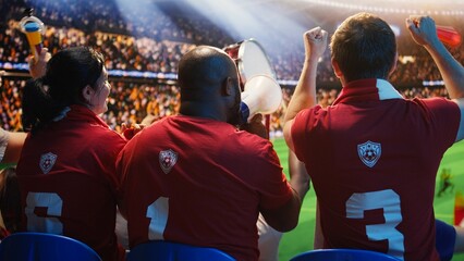 Ecstatic friends celebrate match victory in soccer stadium stands for football fan and match day concepts. © DC Studio