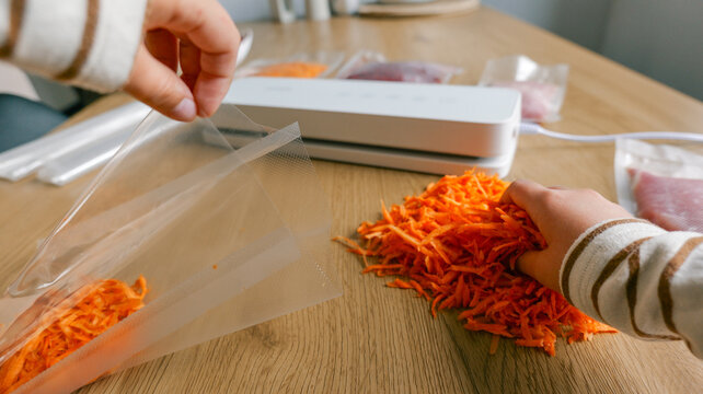 Preparing shredded carrots for vacuum sealing with a food saver machine