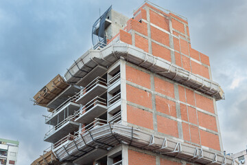 Unfinished Modern Building Under Construction with Exposed Concrete © Richard