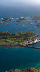 Naklejka premium Aerial View of Lofoten Islands Norway with Coastal Village and Rocky Archipelago