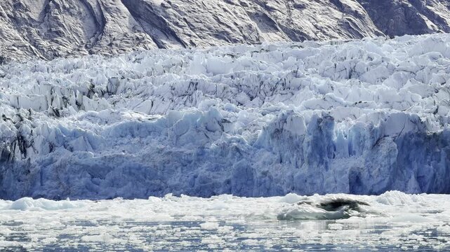 Slow pan across the seracs and blue ice of Dawes Glacier's headwall