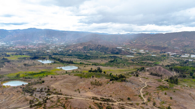 Aerial Drone view road in middle of mountains, nature environment clouddy day, near Villa de Leyva, Boyaca, colombia
