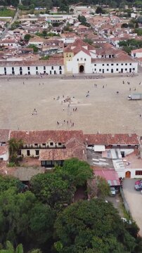 Vertical_Aerial drone view of Villa de Leyva, Boyac&aacute;, Colombia. Colonial city, stone cobbled streets and Plaza Mayor the second largest square in South America - tourist attraction