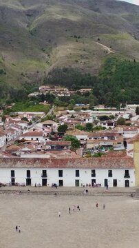 Vertical_Aerial drone view of Villa de Leyva, Boyac&aacute;, Colombia. Colonial city, stone cobbled streets and Plaza Mayor the second largest square in South America - tourist attraction