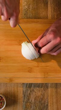 Man cut yellow sweet pepper, Chef hands with knife for onion, cutting and preparation with cooking for dish. Restaurant, culinary service and cook with skills for catering, business and hospitality by