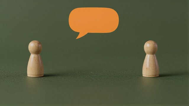 Two wooden figures face each other with an orange speech bubble above.