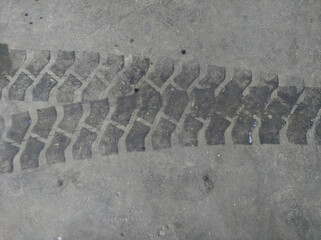 Heavy vehicle tire track mark print on dark asphalt concrete road surface © BAM11