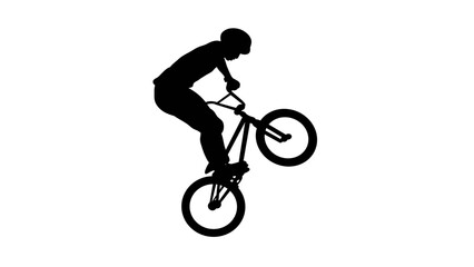 Silhouette of a bmx cyclist doing a manual wheelie stunt © Ating