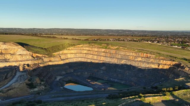 Marino, Adelaide, South Australia &ndash; 4K aerial drone footage of Linwood Quarry, limestone extraction, hard rock aggregates, terraced quarry walls, mining operation between Seacliff Park, Hallett Cove