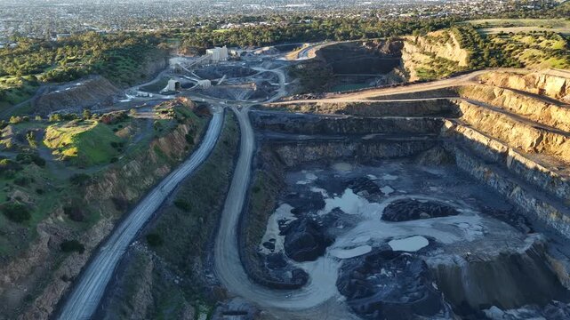Marino, Adelaide, South Australia &ndash; 4K aerial drone footage of Linwood Quarry, limestone extraction, hard rock aggregates, terraced quarry walls, mining operation between Seacliff Park, Hallett Cove