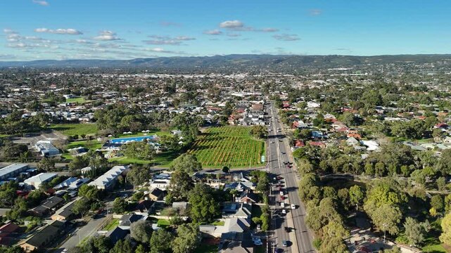 South Australia &ndash; 4K aerial drone footage of suburban neighbourhood, Marion Outdoor Pool, vineyards, tree-lined streets and Adelaide foothills in Park Holme, Oaklands Park and Marion
