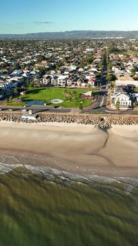 Brighton Beach, Adelaide, South Australia: 4K Vertical Aerial Drone Footage of Coastline, Turquoise Ocean, Sandy Beach, Jetty, Coastal Suburbs, Residential Houses, Estates, Parkland, Scenic Shoreline.