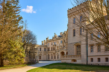 Fototapeta premium Majestic european castle with gothic architecture and sunny landscape