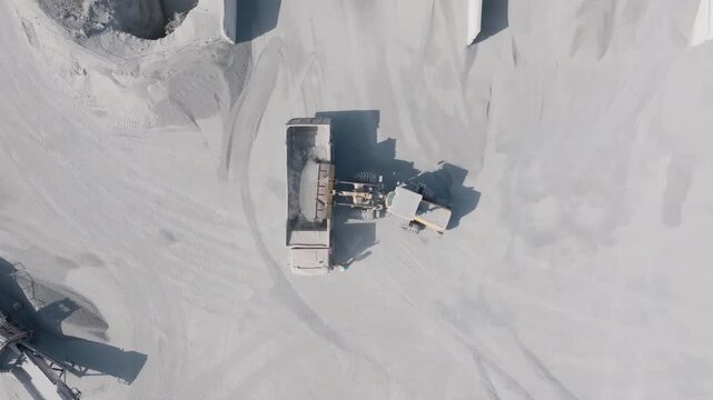 Conveyor Belt Transporting Crushed Rock Through an Industrial Quarry Facility