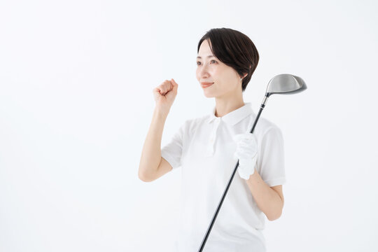 ガッツポーズをする女性　ゴルフ　白バック