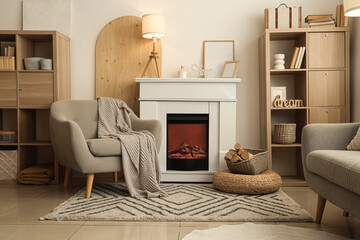 Obraz premium Interior of cozy living room with armchair, fireplace and shelving units