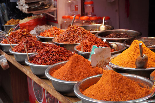 A taste of Guizhou. Bold and spicy local chili dishes at the historic Qingyan Ancient Town market, China.