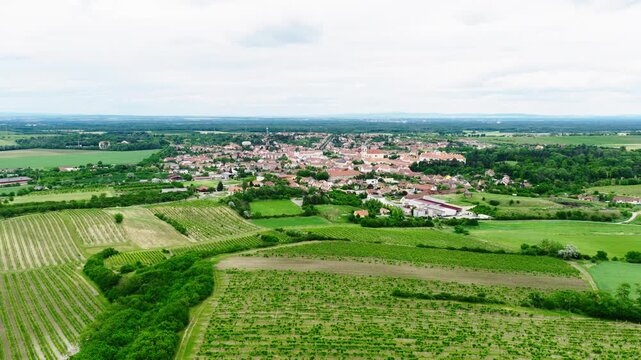 Drone aerial panorama of Valtice, Czech Republic, surrounded by vineyards, rolling countryside, and the UNESCO-listed Lednice&ndash;Valtice Cultural Landscape. Historic town center in the heart Morava.