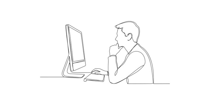 A man sitting at a desk in front of a computer thinking deeply