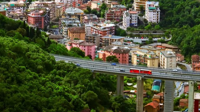 Telephoto drone shot of traffic on concrete viaduct, sunny day in Rapallo, Italy