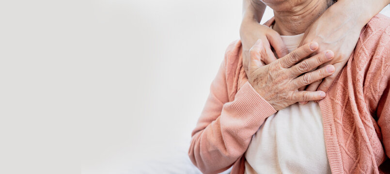 A close-up of a young person's hands gently comforting and showing love to an elderly woman. Symbolizing care, support, encouragement and mental health awareness.