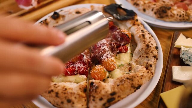 Chef Pouring Olive Oil Over Gourmet Neapolitan Pizza with Prosciutto