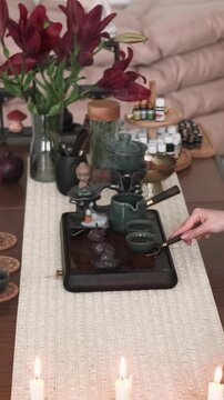 Vertical video. Traditional drink. Tea ritual. Female preparing Chinese ceremony enjoying meditation aromatherapy spiritual enlightenment indoor.