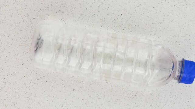 Recyclable plastic bottle, symbol of sustainability and care for the environment. Recyclable plastic bottle detail, an ecological choice to reduce environmental impact.