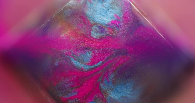 Paint wave. Splatter texture. Defocused purple blue pink colorful glitter cube geometric sparkling liquid floating on abstract art background.