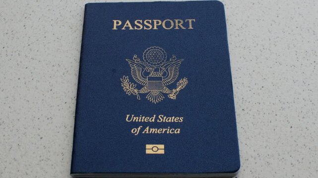 American Passport and Dollars: Fascinating detail of the US passport with dollar bills, symbolizing travel, exchange and money.
