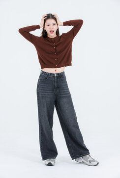 Full body portrait beautiful asian happy smile cute young teenage woman long black hair wearing casual clothes posing confidently look at camera isolated on white background studio lifestyle concept.