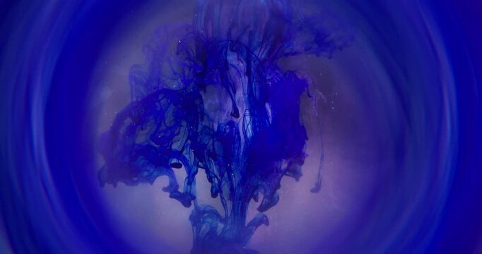 Paint blot. Pouring pigment. Blue white pink color dye spilling diamond. Sparkling haze fluid round frame defocused abstract water background.