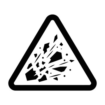 A black and white triangular warning sign for explosive hazards