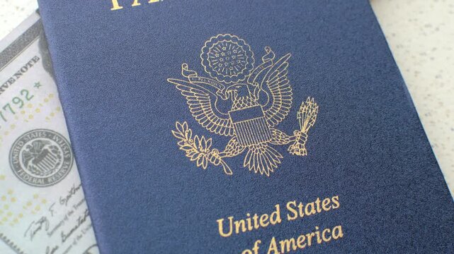 American Passport and Dollars: Fascinating detail of the US passport with dollar bills, symbolizing travel, exchange and money.