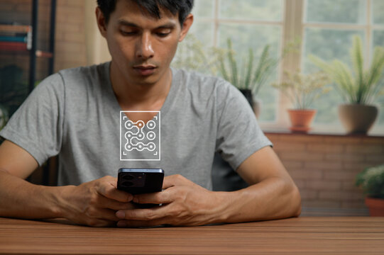 Young Man Using Smartphone with Digital Circuit Overlay in Bright Indoor Space