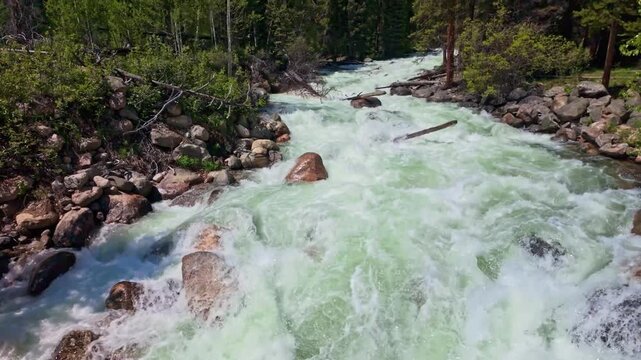 Scenic view of Lake Creek flowing through the mountains beside Beartooth Highway in Wyoming