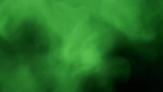 Radiant abstract green smoke drifting across dense haze delivering captivating cinematic texture