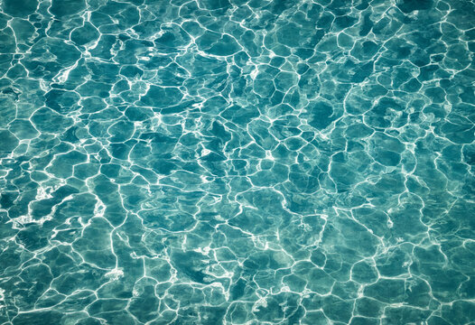 Crystal clear swimming pool water with sunlight reflections sunlight reflection turquoise abstract swimming background caustics refreshing transparent outdoors backdrop movement wellness