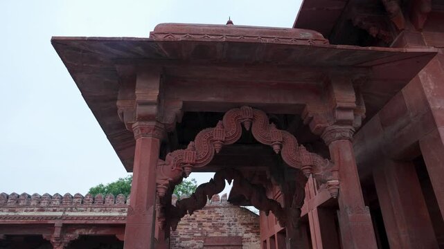 Mughal Architectural Detail Featuring Ornate Arches and Stone Pillars