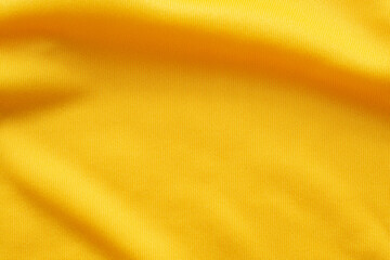 Fototapeta premium Yellow sports clothing fabric football shirt jersey texture