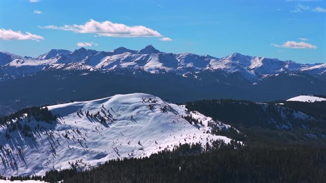 Mount of the Holy Cross winter morning blue sky sunny Vail Pass White River National Forest landscape aerial drone Sawatch Range Colorado Rockies snow-covered peaks cornice bowl ski zone backcountry