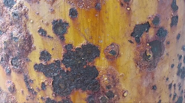 Slow Upward Pan of Rusty Metal Surface with Corrosion and Oxidation
